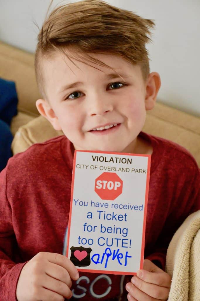 Oliver with a greeting card he hands out to senior citizens