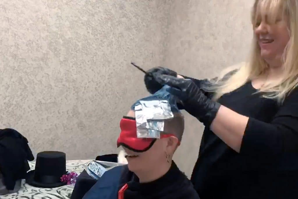 Theresa Coleson getting her hair dyed in the color of the gender of her baby.