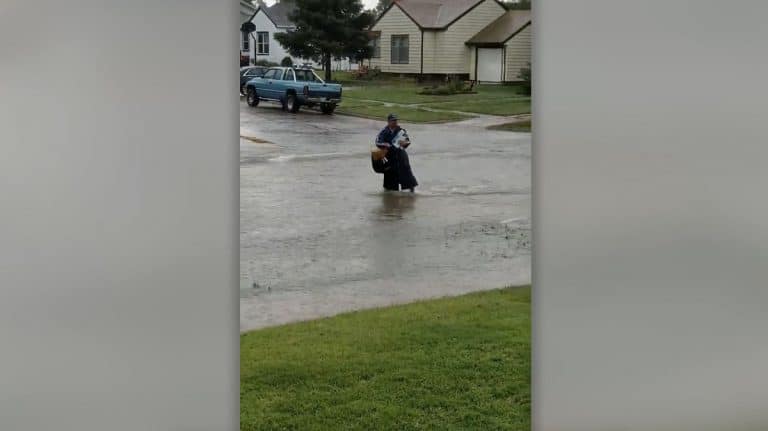 Mailman Battles Through Floods To Deliver Mail