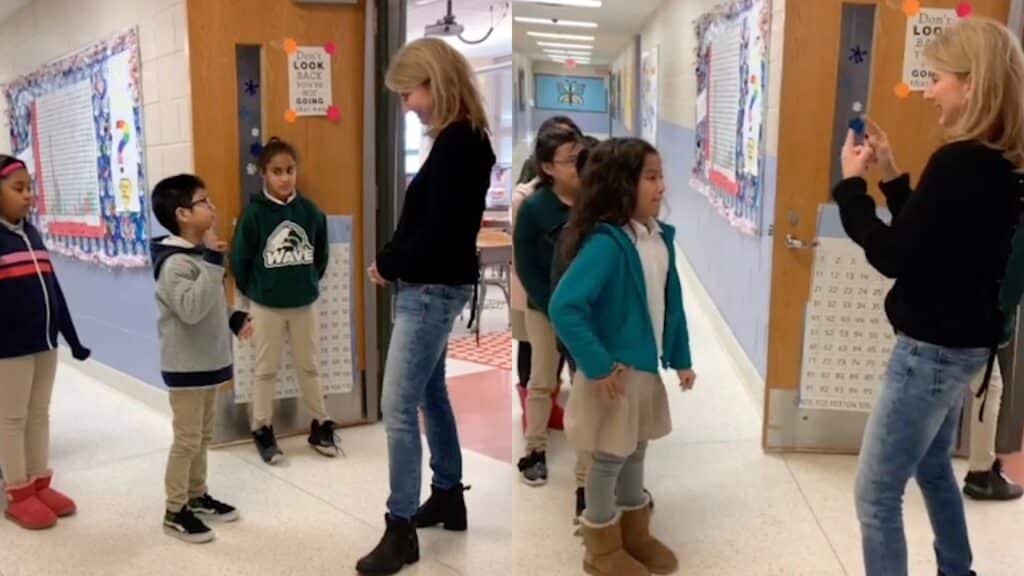 Students greet their deaf teacher with sign language