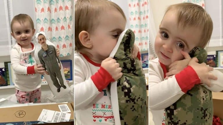 Little Girl Hugs And Kisses Special Doll Of Navy Dad To Comfort Her While He Is Deployed Little Girl Hugs And Kisses Special Doll Of Navy Dad To Comfort Her While He Is Deployed