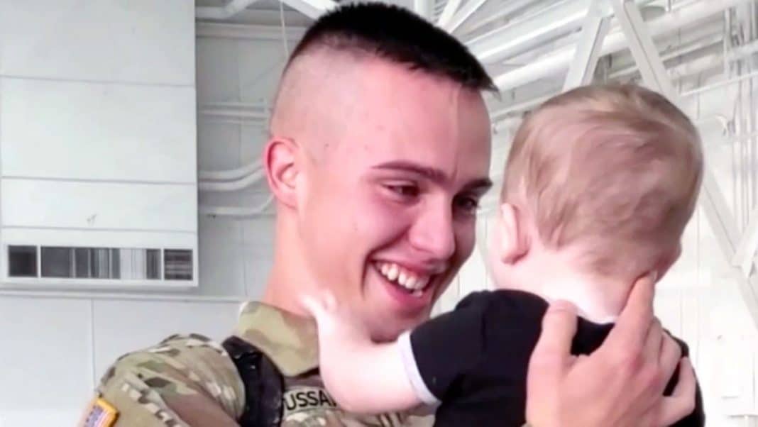 Soldier meets newborn son