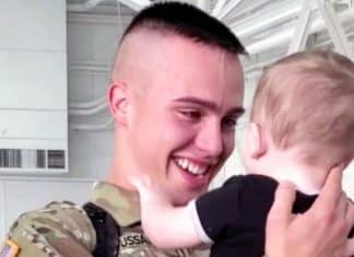 Soldier meets newborn son