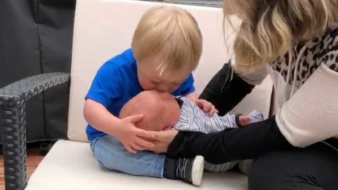 Baby with down syndrome meets brother
