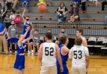 Landon scores during a basketball game
