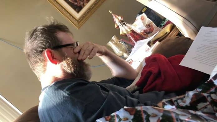 A stepdad cries as he is surprised with adoption papers