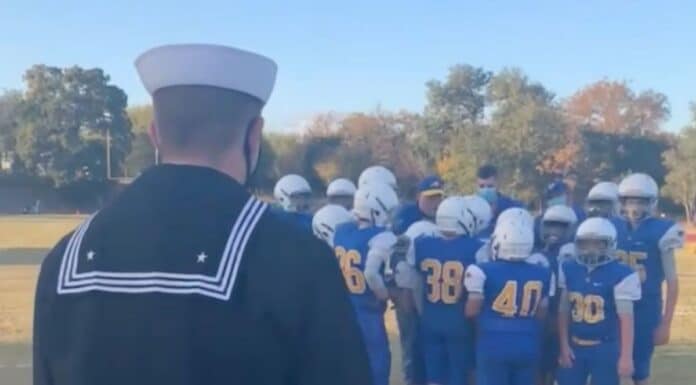 Navy brother surprises sibling during football huddle