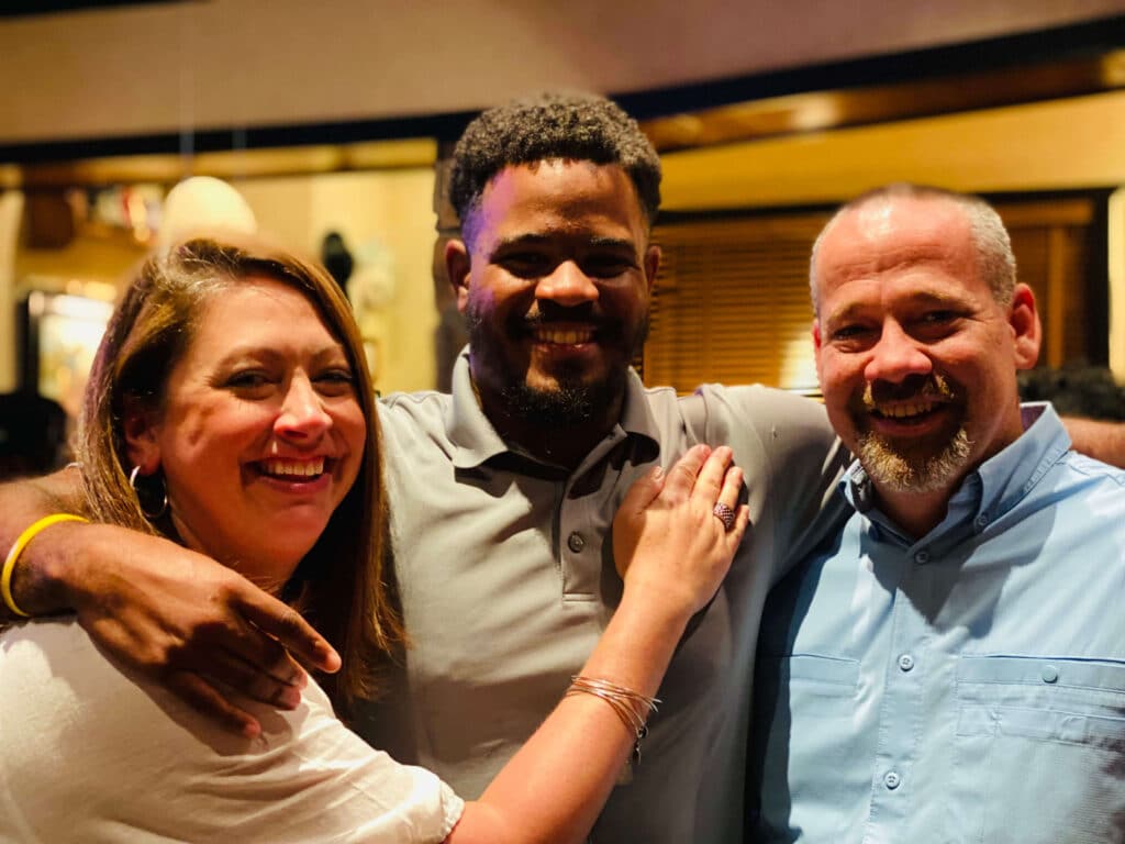 Davon with his forever family parents Mandy and Chuck