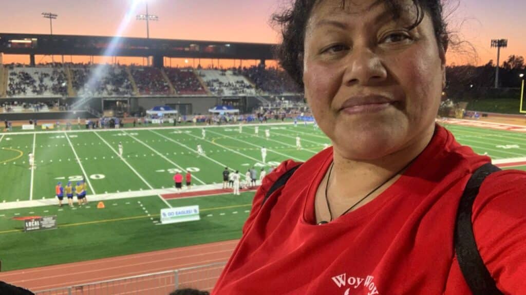 Tina at Max's first football game. 