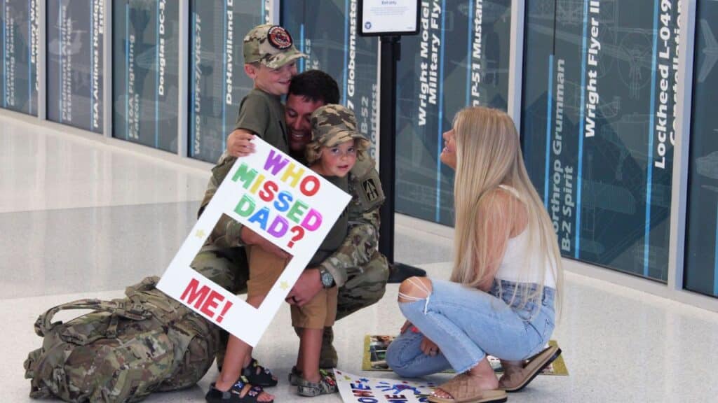 The family reunite at the airport.