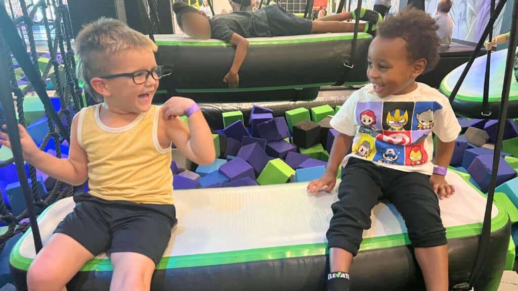 The boys play at a soft play