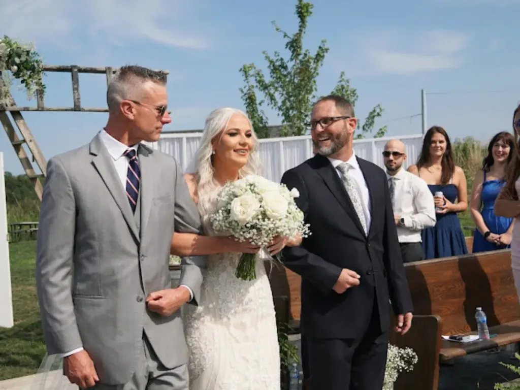 Walking down the aisle arm-in-arm.