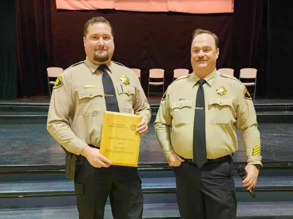 Lassen County sheriff's deputy Derek Kennemore (pictured left receiving a service award).