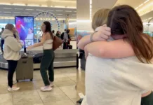 Darcy 'steals' her best friend Abigail's suitcase at the luggage carousel in South Carolina, USA.