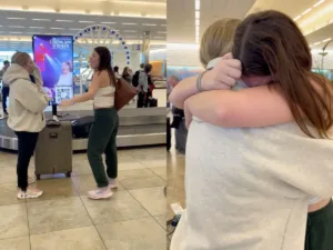 Darcy 'steals' her best friend Abigail's suitcase at the luggage carousel in South Carolina, USA.