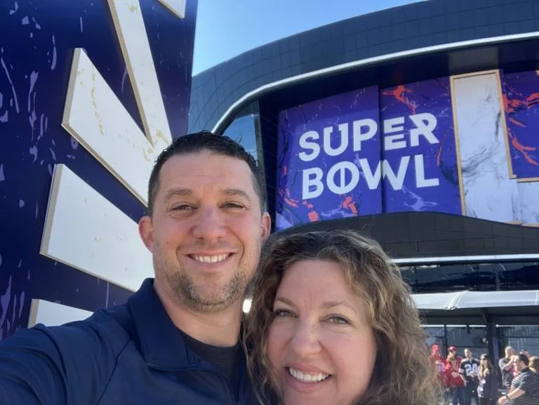 Last years winner, David Suggs and his wife at the Super Bowl.