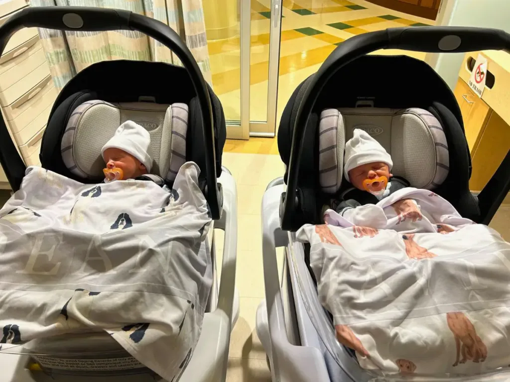 The twins leaving NICU after two weeks.