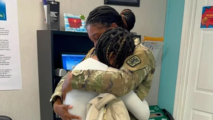 A heartfelt reunion between a mother in military uniform and her teenage daughter, tightly embracing each other with evident emotion.