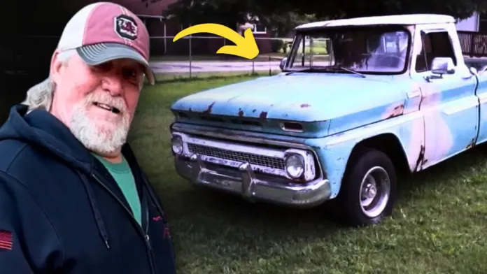 Donnie Couch smiling beside his cherished blue and white 1965 Chevrolet C10 truck.