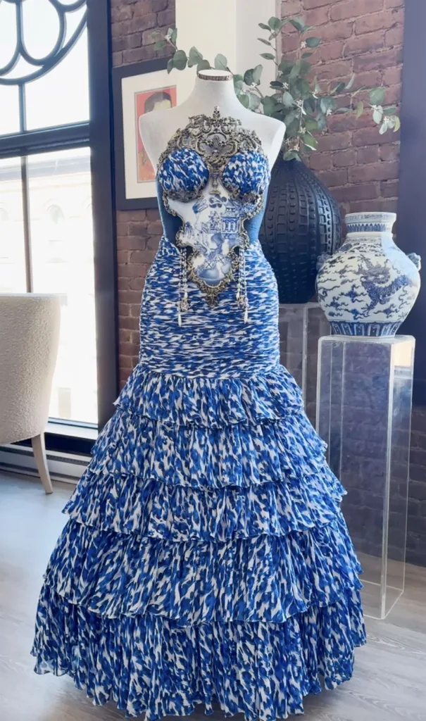 Repurposed prom dress redesigned with intricate embroidery and modern flair displayed on a mannequin.