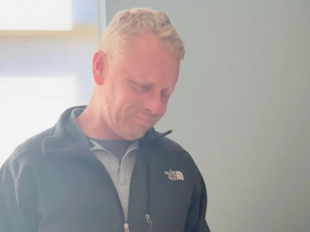 Brad Cone looks down and tears up as he realizes his stepdaughter named her child after him.