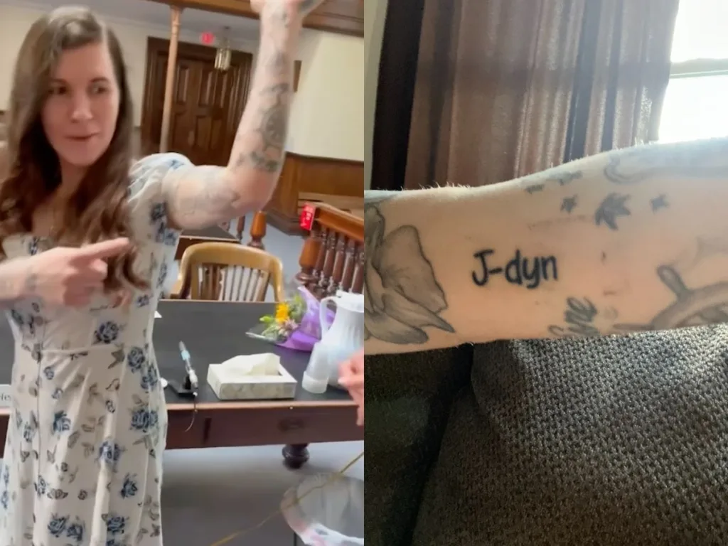 Adoptive mom in a floral dress points to a new name on her family tree tattoo as a teen holding flowers reacts emotionally in a courtroom.