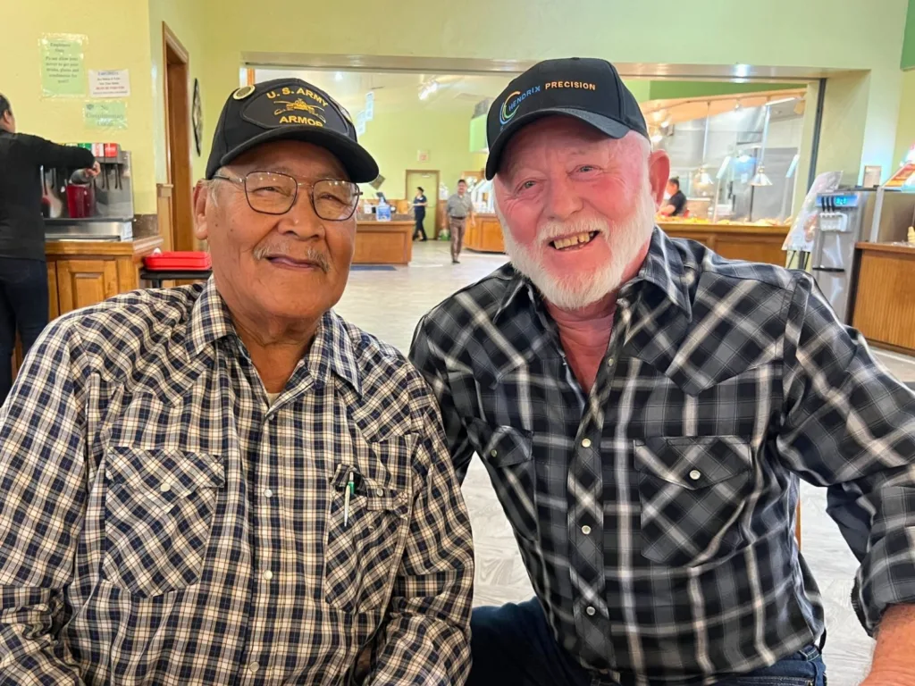Younger photo of Melvin and Ronnie during their time in the military decades earlier.