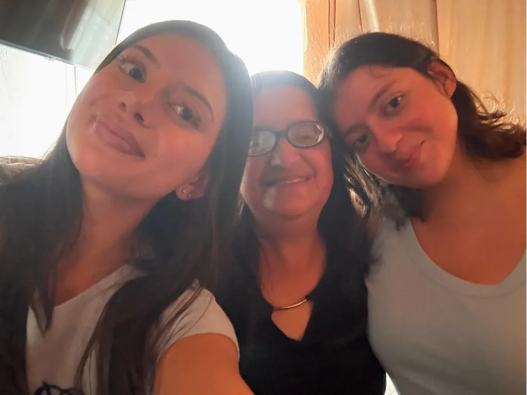 Rachel, Emelie and Mariana smile together for a selfie after meeting in Colombia.