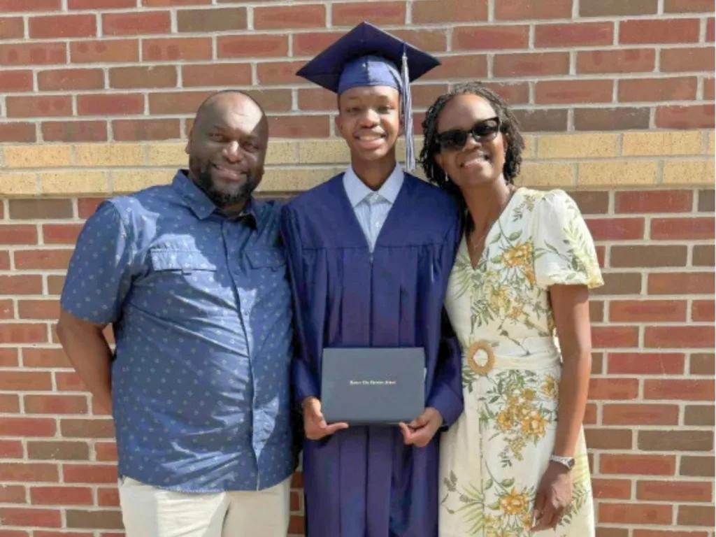 Dylan with his parents on graduation day.